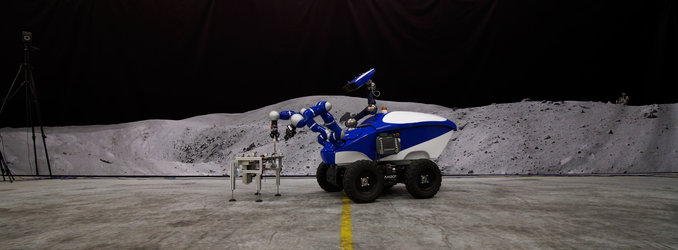 The Interact Centaur Rover in front of a Moon panorama