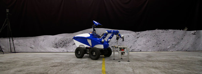 The Interact Centaur Rover in front of a Moon panorama