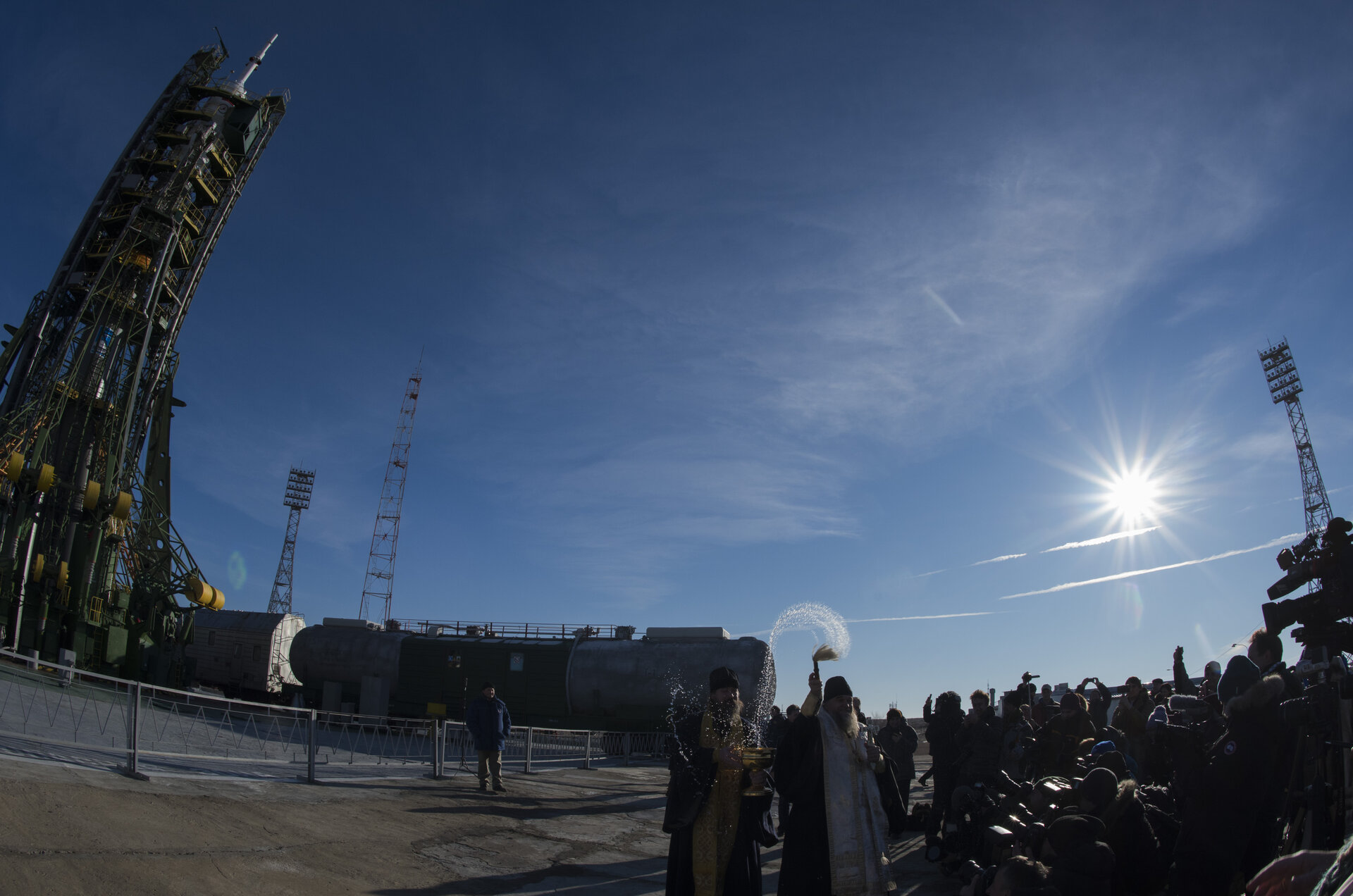 An Orthodox Priest blesses members of the media 