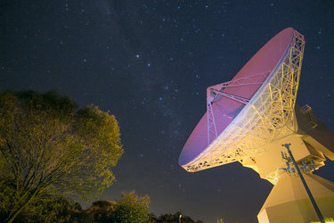 ESA's dish antenna at New Norcia, Australia, glows with reflected laser light