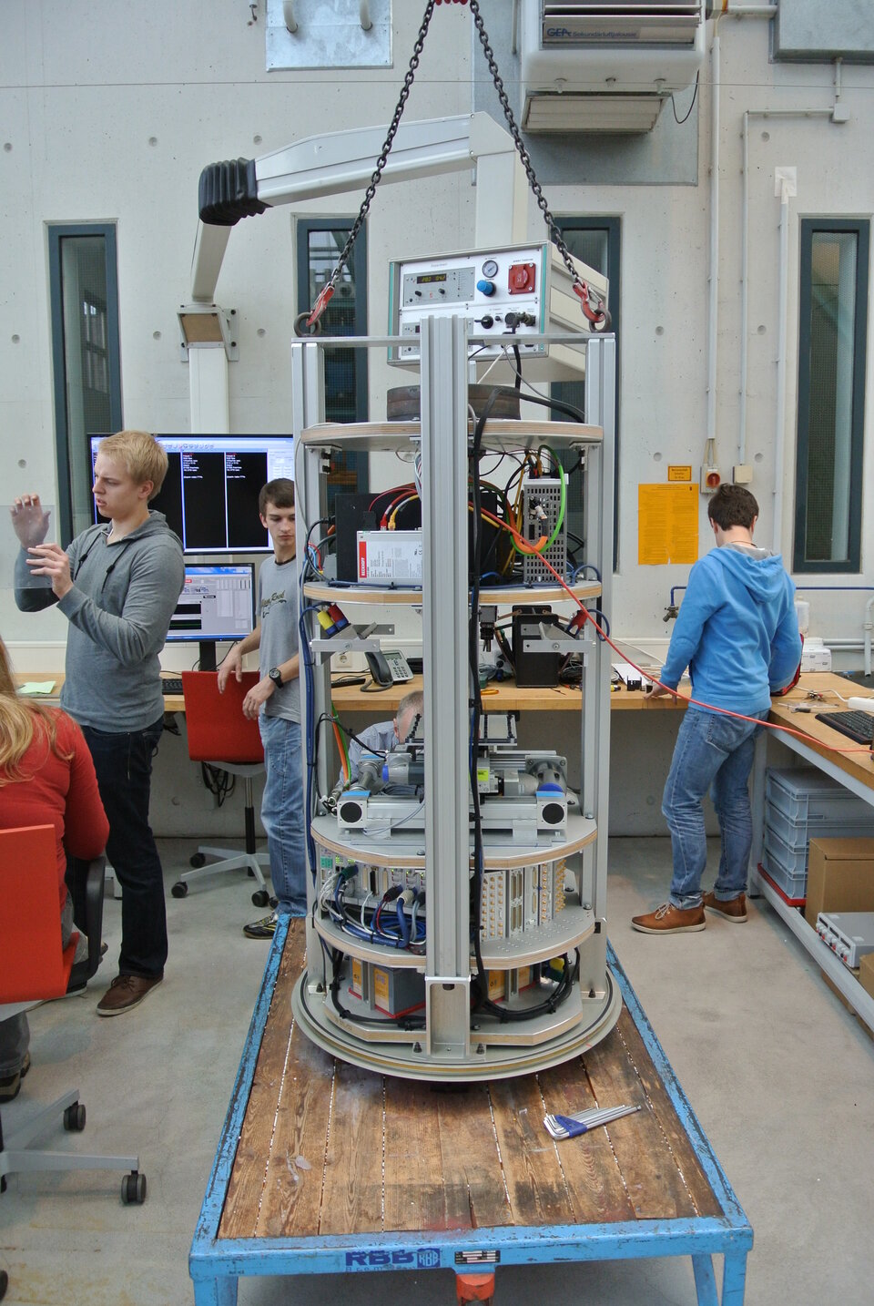 A disassembled capsule with student experiment on the middle platform