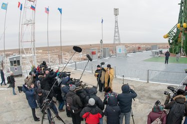 An Orthodox Priest blesses members of the media