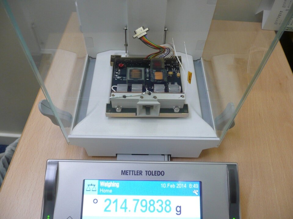 PPTCUP module being weighed on a microbalance 