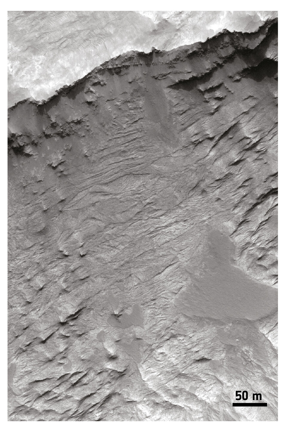 Cross-bedding stratifications in sedimentary rocks, Hellas Basin region. Credit: NASA/JPL/University of Arizona