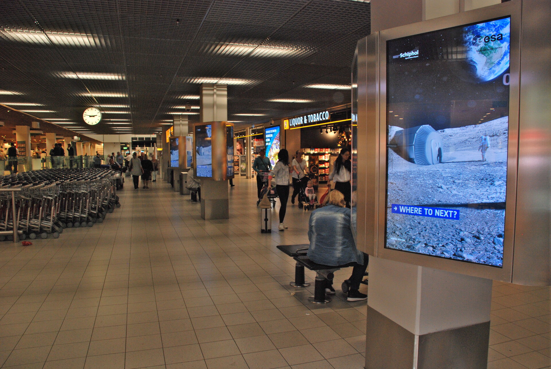 Moon Village poster at Schiphol Airport