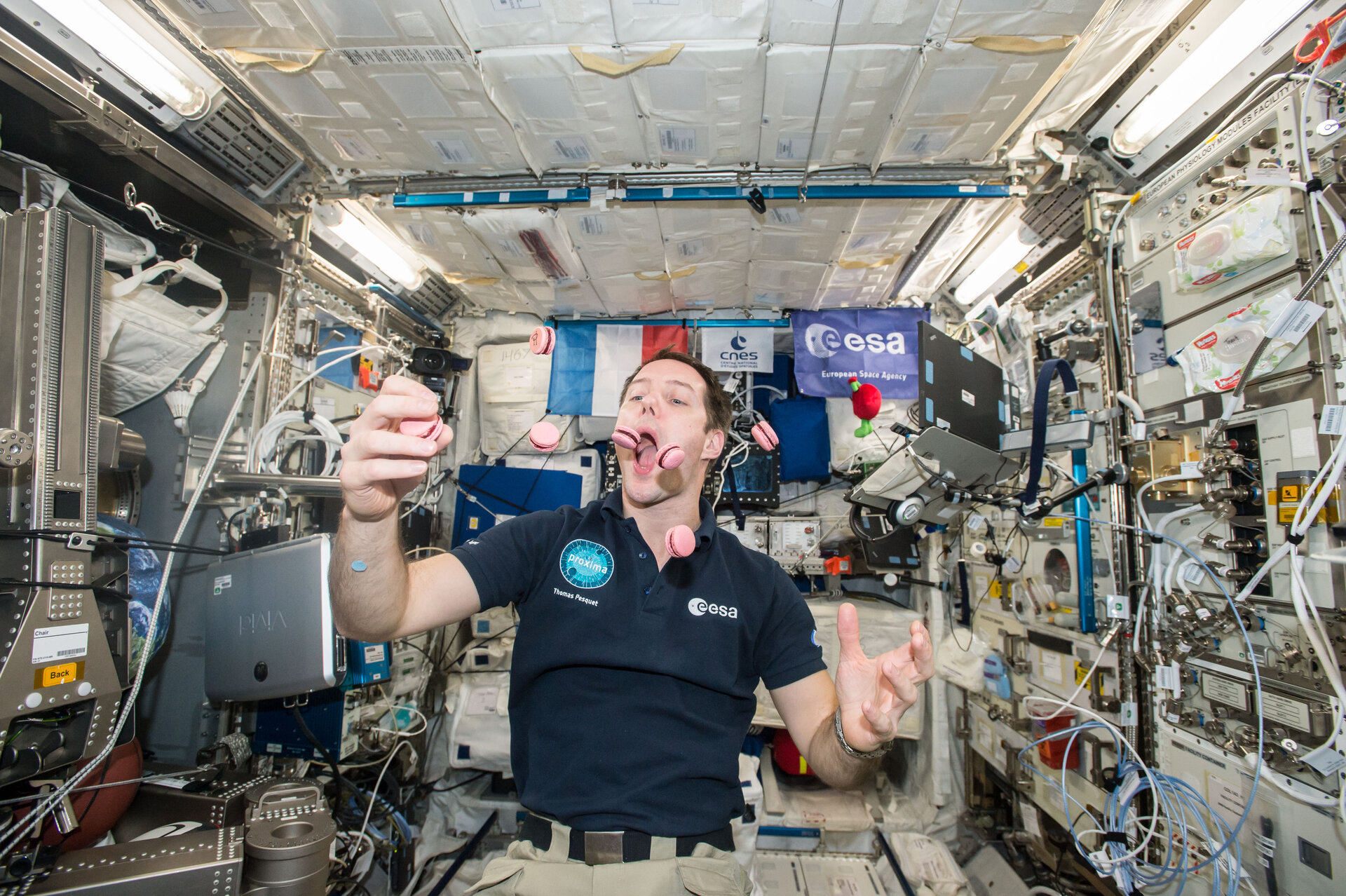 ESA astronaut Thomas Pesquet with a special delivery of French macarons