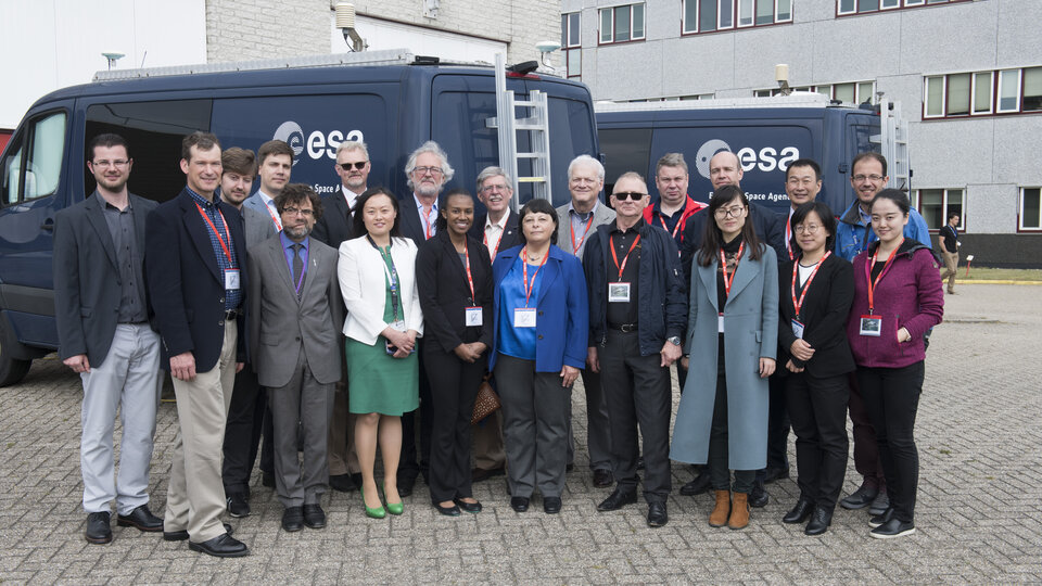 UN ICG delegates beside Galileo vans