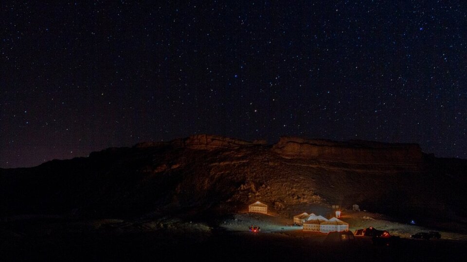 Tents under desert sky