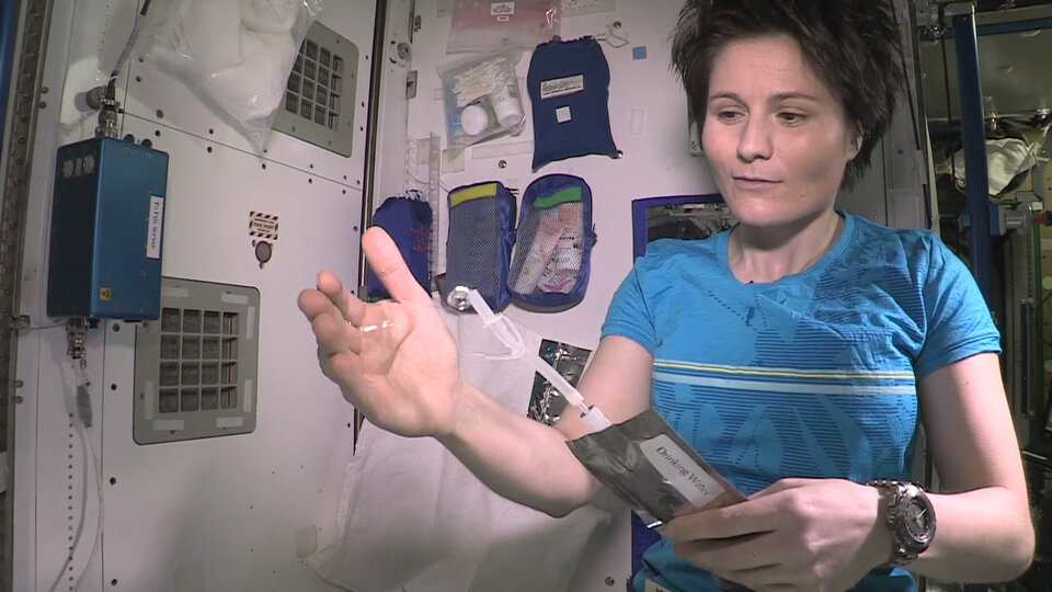 Samantha Cristoforetti with water on Space Station