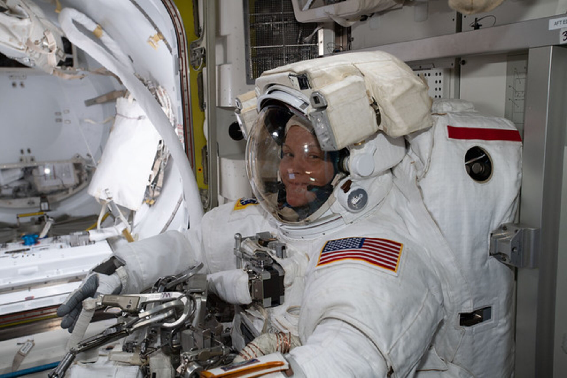 NASA astronaut Anne McClain prepares for a spacewalk