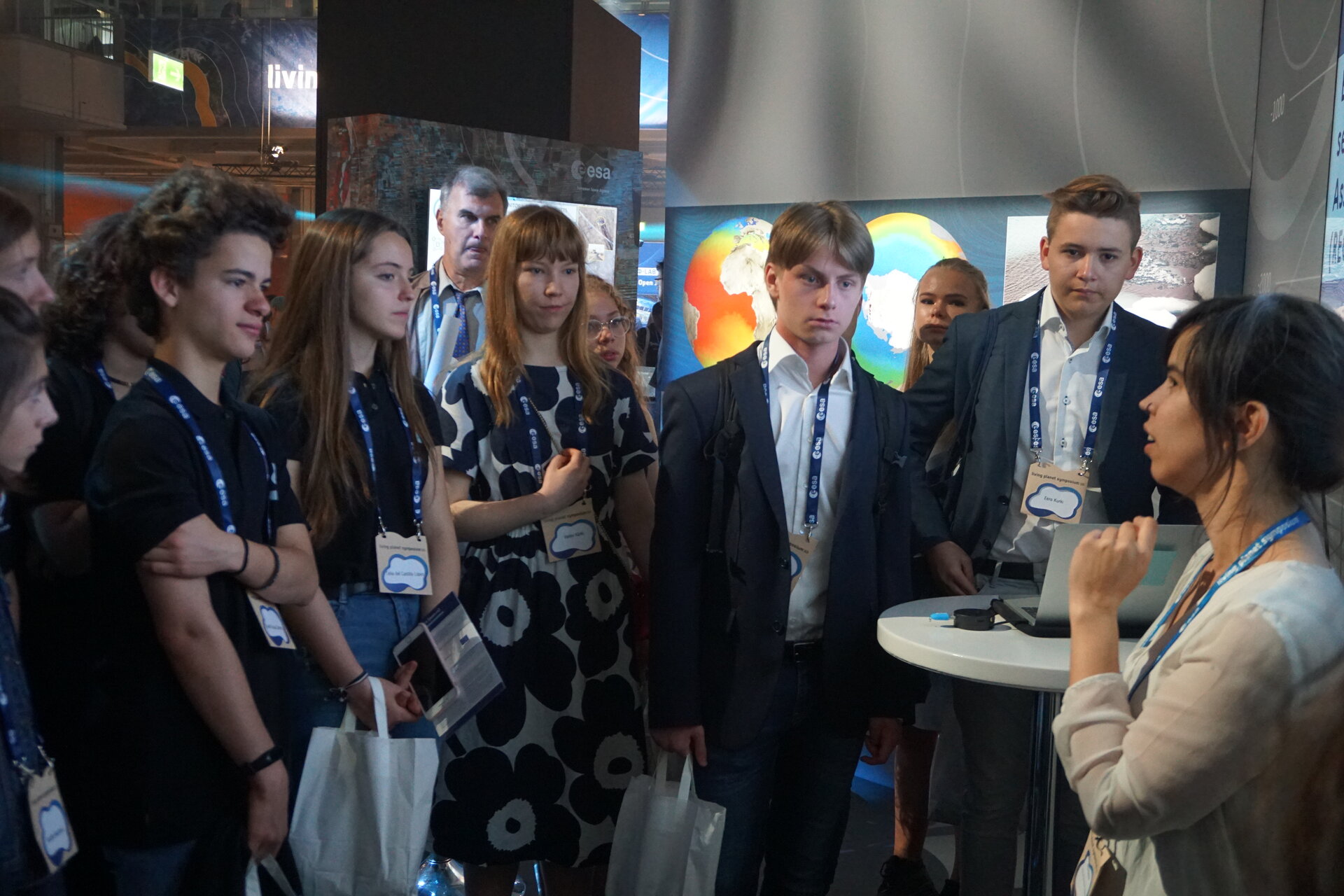 Students at the ESA booth talking with scientists