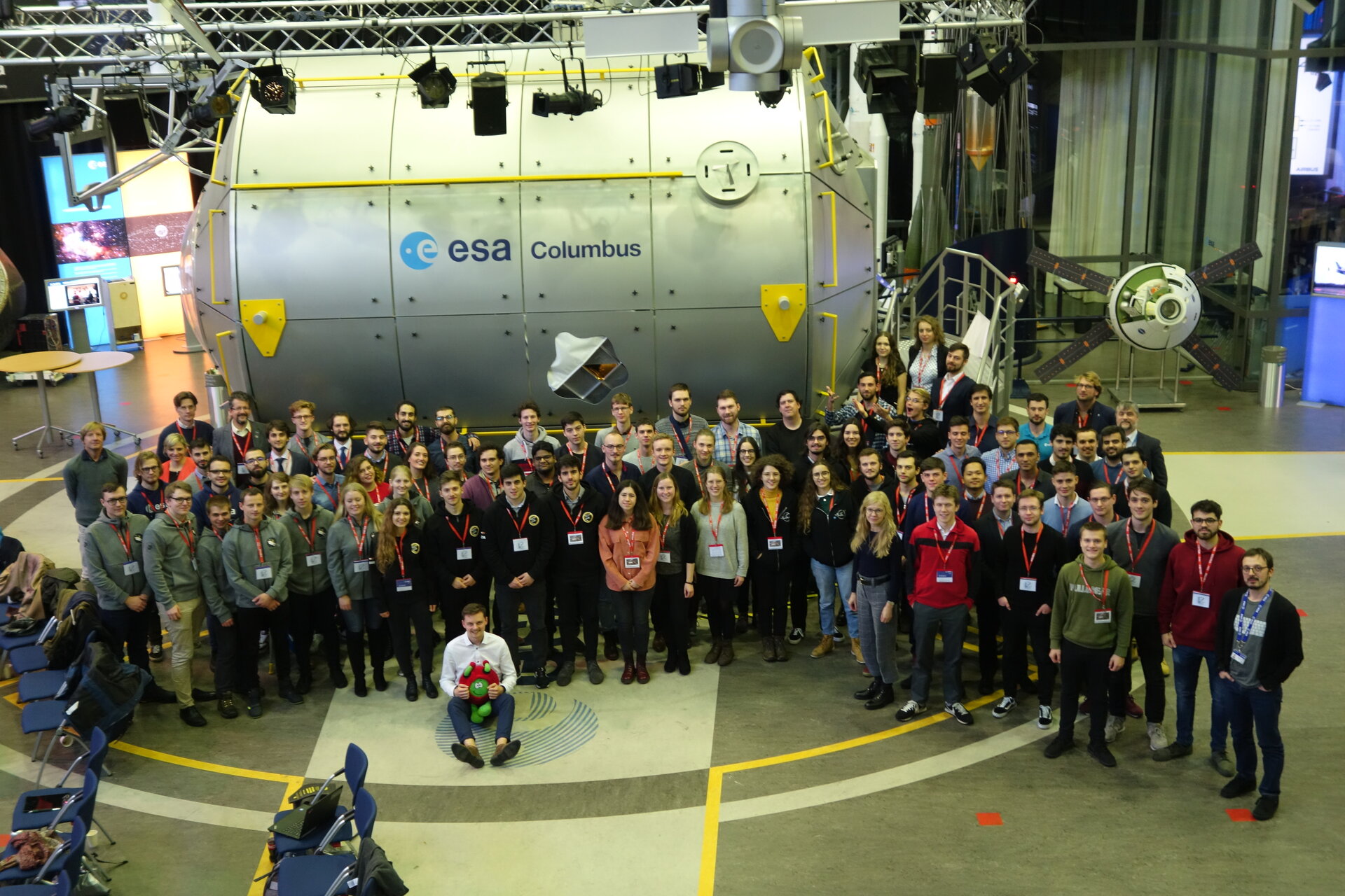 Teams and the panel with the Columbus mock-up during the Selection Workshop
