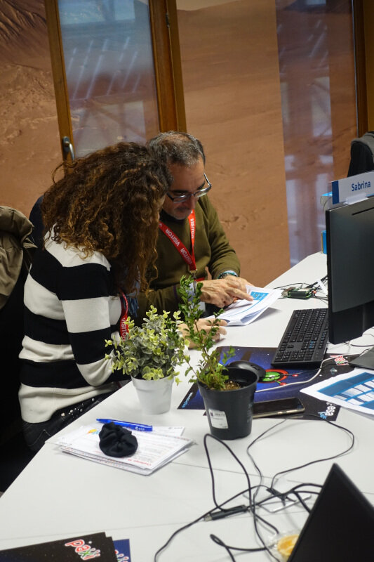 Teachers using the Astro Pi to distinguish a fake plant from a real one