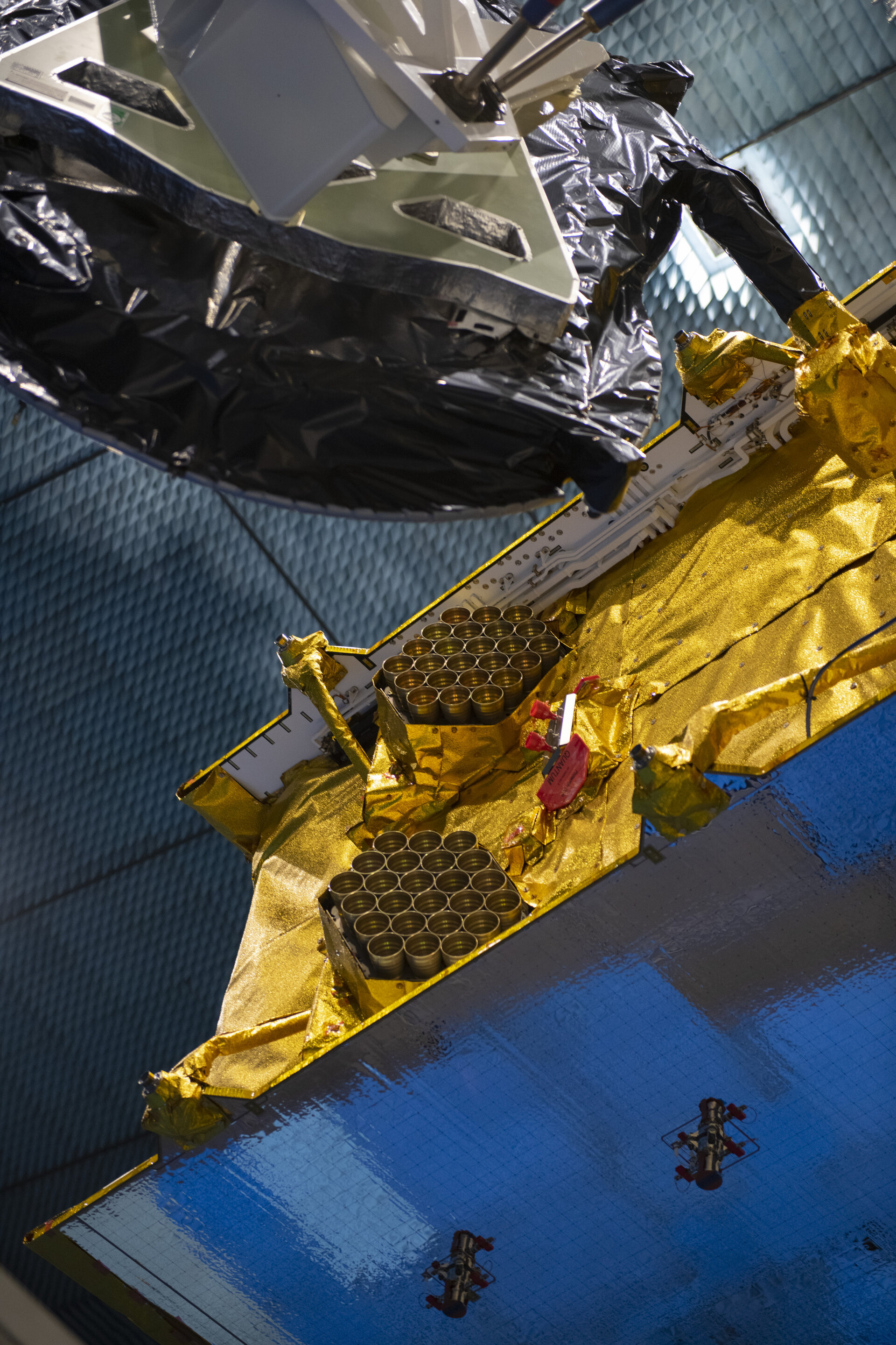 Detail of the Eutelsat Quantum satellite in a radio-frequency test chamber