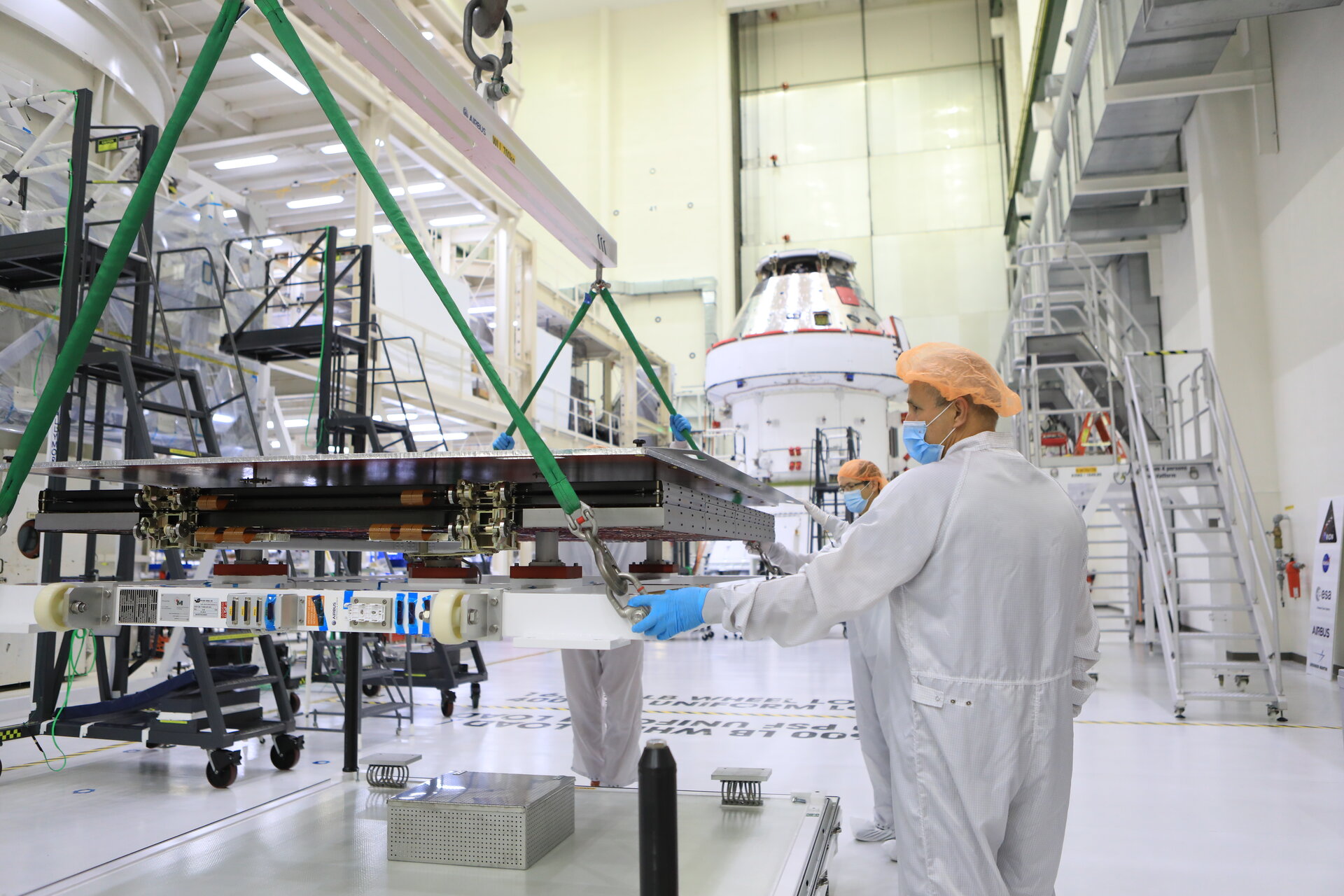Installing solar wings on Orion