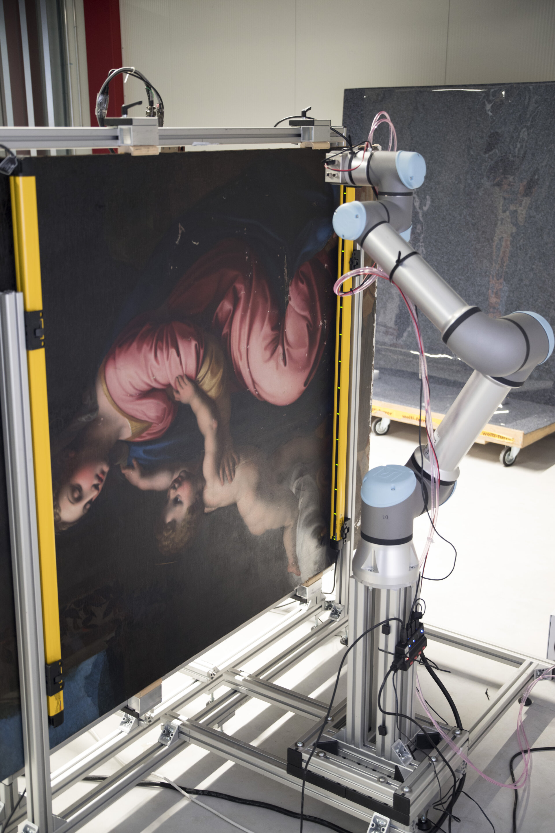 Robotic X-ray scanner with the Madonna and Child painting