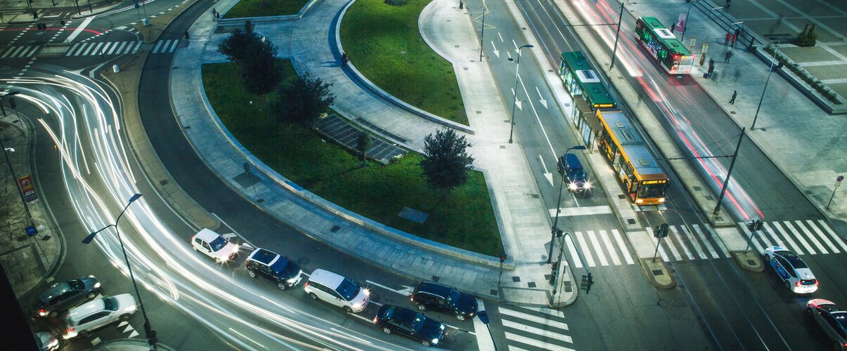 Smart mobility with cars on city streets at night