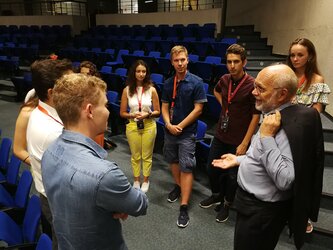 Prof. Armel Kerrest (Vice Chairman of the ECSL Board) discussing with students at the ECSL Summer Course 2019 in Messina, Italy.