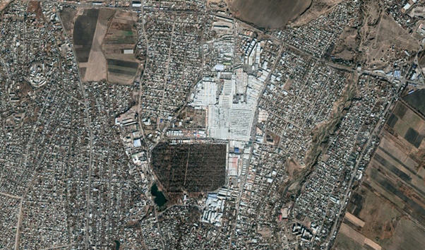 <a href="https://en.wikipedia.org/wiki/Dordoy_Bazaar" target="_blank" ><b>Dordoy Bazaar</b></a> in the northeastern outskirts of Bishkek in Kyrgyzstan is one of Asia's largest public markets. It is the white region at the centre of this image.