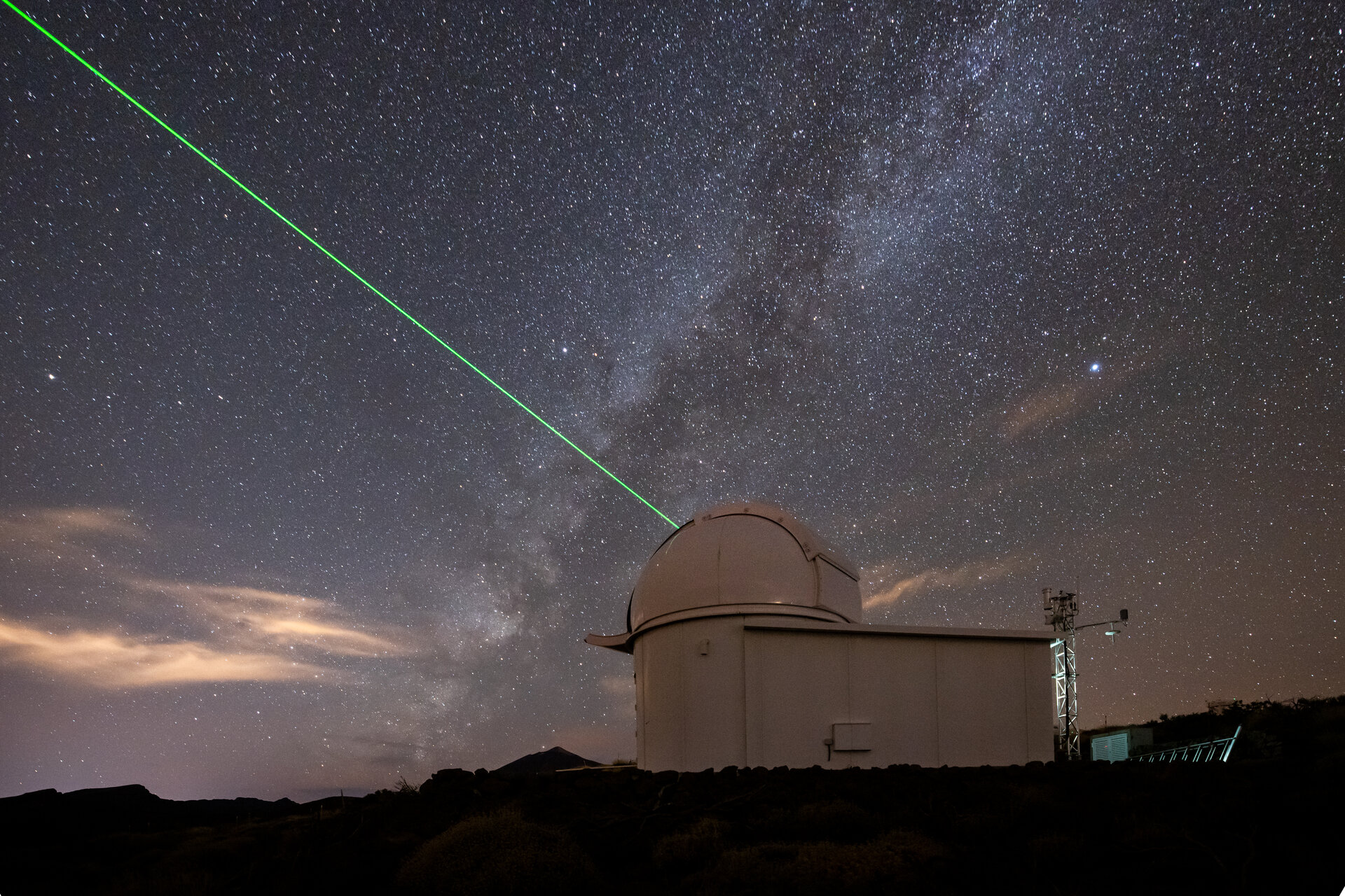 ESA's laser ranging station in Tenerife aims its green laser to the sky