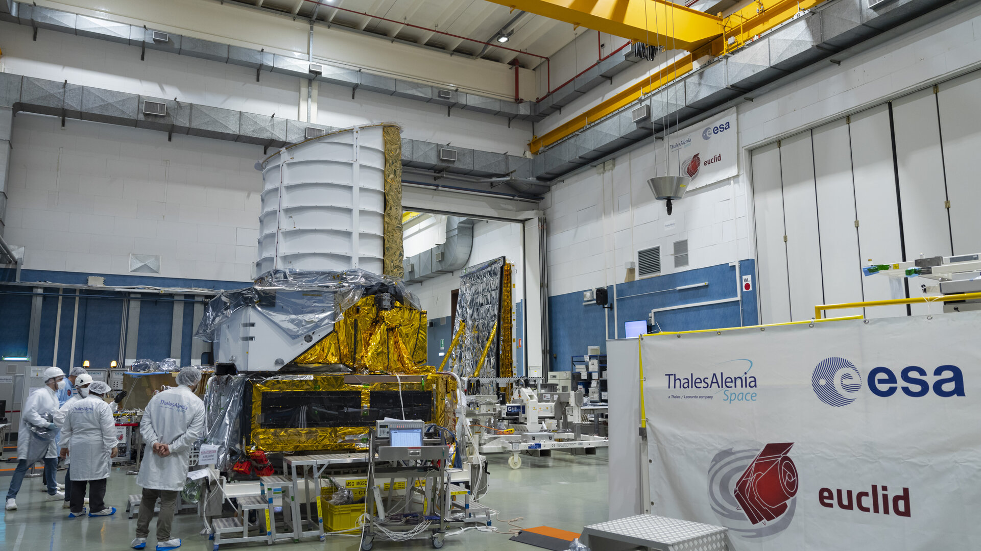 ESA, Thales Alenia Space and Airbus engineers attach Euclid’s payload and service modules