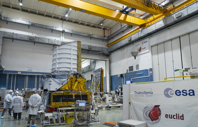 ESA, Thales Alenia Space and Airbus engineers attach Euclid’s payload and service modules