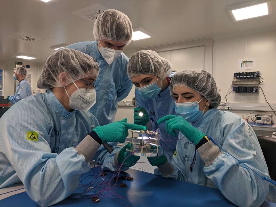 Students inspect hardware after test