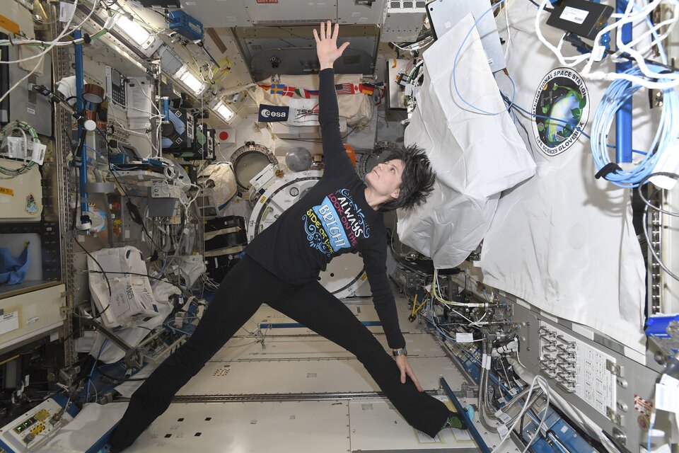 ESA astronaut Samantha Cristoforetti trying out the yoga plan @CosmicKidsYoga prepared for her!