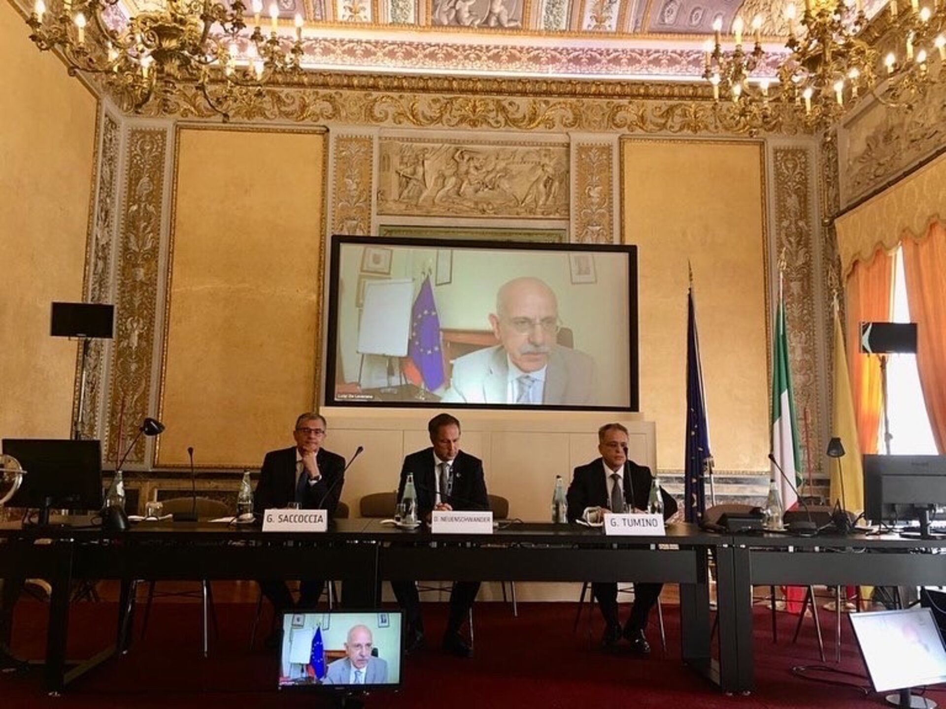 General Luigi De Leverano, military adviser to Italian prime minister Mario Draghi, addresses delegates; also pictured are ASI president Giorgio Saccoccia, Daniel Neuenschwander and Giorgio Tumino