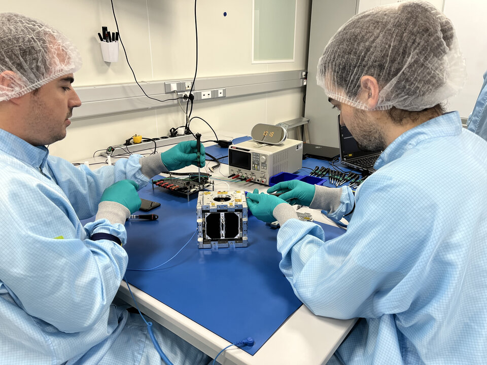 3Cat-4 team integrating their CubeSat into the Vibration Test Adapter