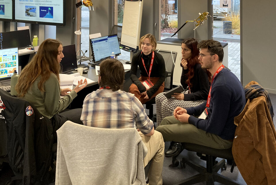 Students working on their group project during an ESA Academy training course