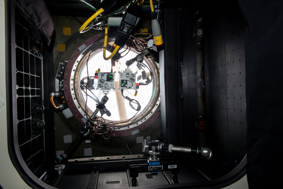 Two Astro Pis positioned in an observation window on the ISS 