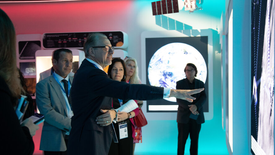 ESA Director General Josef Aschbacher photographed during his visit of ESA's exhibition inside the Space Pavilion.  