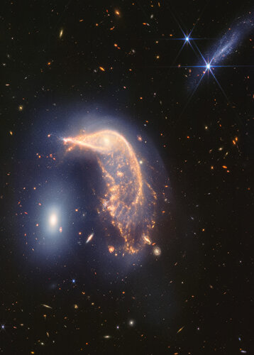 Vivid Webb portrait of interacting galaxies Pinguin and Egg